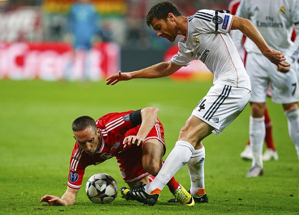 Bayern Munich's Ribery is challenged by Real Madrid's Alonso during their Champions League semi-final second leg soccer match in Munich