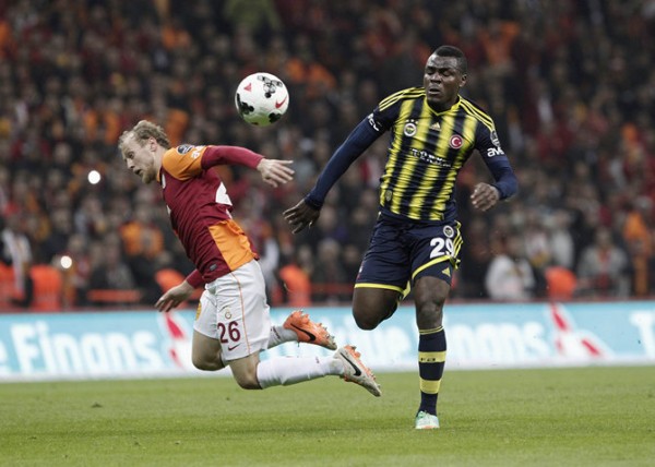 Fenerbahce's Emenike fights for the ball with Galatasaray's Kaya during their Turkish Super League derby soccer match