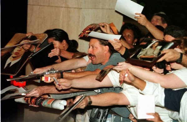 Fans ask for autographs during the premiere of the