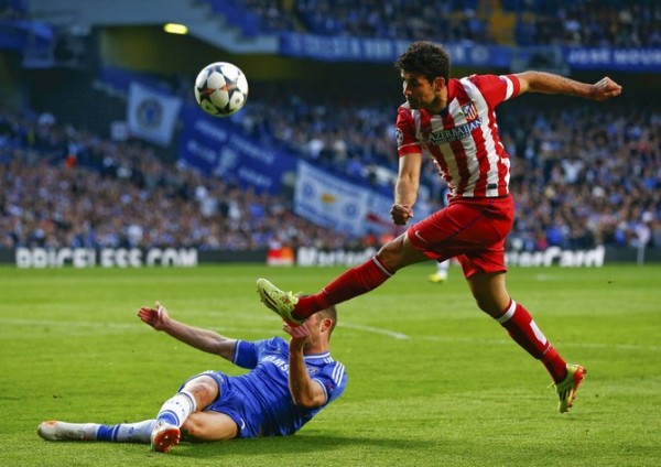 Atletico's Costa fails to score blocked by Chelsea's Cahill during their Champions League semi-final second leg soccer match at Stamford Bridge in London