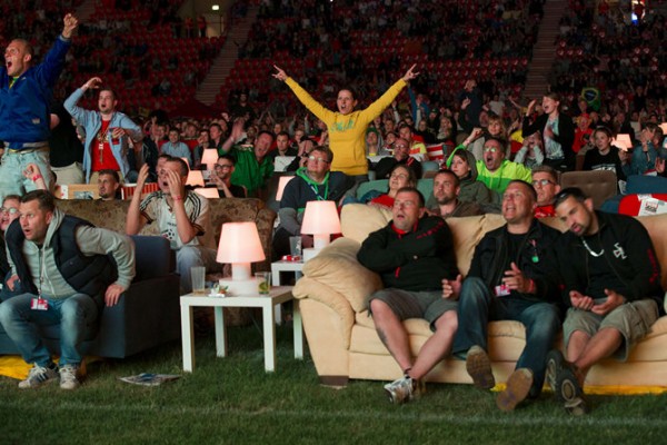 People react as Brazil scores against Croatia during a public viewing of the opening game of the 2014 World Cup at Alte Foersterei stadium in Berlin
