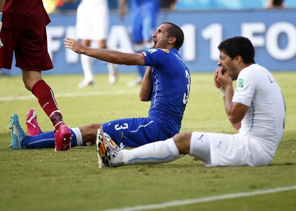 Uruguay's Luis Suarez reacts after clashing with Italy's Giorgio Chiellini during their 2014 World Cup Group D soccer match at the Dunas arena in Natal