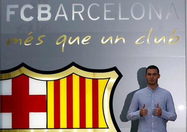 Belgium soccer player Vermaelen poses next to a logo at his arrival at FC Barcelona's offices in Barcelona