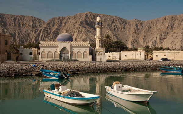 Motorboats moored in canal in front of a mosque, Khasab, Musandam, Sultanate of Oman