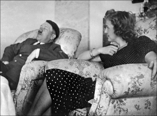 Undated and unlocated picture of German Chancellor and "Reichsführer" (chief) Adolf Hitler relaxing with his mistress Eva Braun.