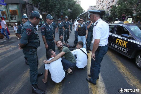 Protesters hold a civil disobedience