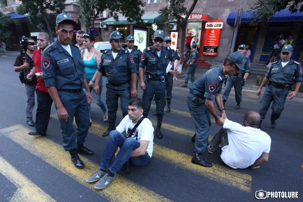 Protesters hold a civil disobedience