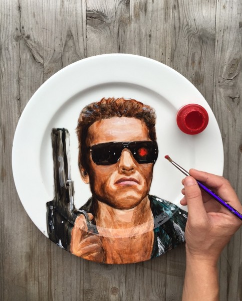 MANDATORY CREDIT: Jacqueline Poirier/REX Shutterstock. Only for use in this story. Editorial Use Only. No stock, books, advertising or merchandising without photographer's permission Mandatory Credit: Photo by REX Shutterstock (5168139p) Arnold Schwarzenegger's portrait on a plate by Jacqueline Poirier Celebrity Plate Paintings, Toronto, Canada - 24 Sep 2015 FULL BODY: http://www.rexfeatures.com/nanolink/r4c4 A Canadian artist paints portraits of celebrities onto plates.  Jacqueline Poirier is the Resident Artist at Toronto's Ritz-Carlton. Her work is showcased throughout the hotel's restaurant, and aside from celebrity portraits range from landscapes, food and animals.