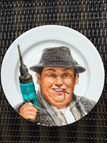 MANDATORY CREDIT: Jacqueline Poirier/REX Shutterstock. Only for use in this story. Editorial Use Only. No stock, books, advertising or merchandising without photographer's permission Mandatory Credit: Photo by REX Shutterstock (5168139c) John Candy's portrait on a plate by Jacqueline Poirier Celebrity Plate Paintings, Toronto, Canada - 24 Sep 2015 FULL BODY: http://www.rexfeatures.com/nanolink/r4c4 A Canadian artist paints portraits of celebrities onto plates.  Jacqueline Poirier is the Resident Artist at Toronto's Ritz-Carlton. Her work is showcased throughout the hotel's restaurant, and aside from celebrity portraits range from landscapes, food and animals.