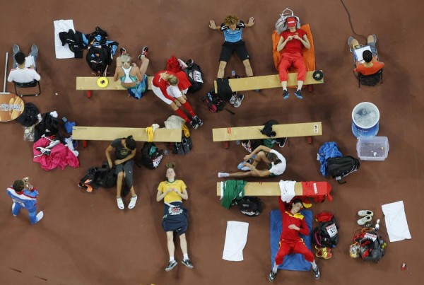 Athletes wait for their turns at the women's high jump final during the 15th IAAF World Championships at the National Stadium in Beijing, August 29, 2015.  REUTERS/Fabrizio Bensch