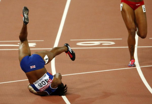 Tiffany Porter of Britain falls after competing in the women's 100 metres hurdles final during the 15th IAAF World Championships at the National Stadium in Beijing, August 28, 2015. REUTERS/David Gray