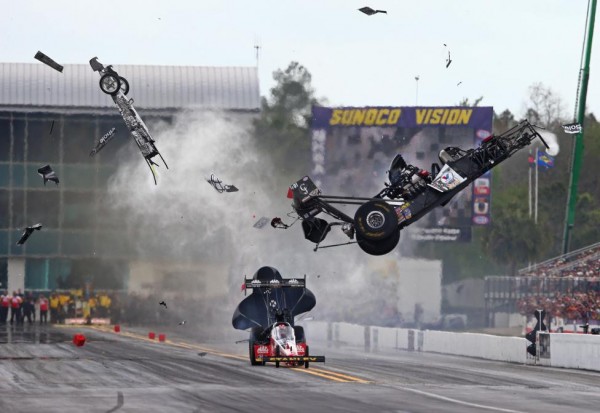 NHRA top fuel dragster driver Larry Dixon (right) crashes and goes airborne alongside Doug Kalitta after his car broke in half during qualifying for the Gatornationals at Auto Plus Raceway at Gainesville, Florida, March 14, 2015. Dixon walked away from the incident,         Mark J. Rebilas-USA TODAY Sports