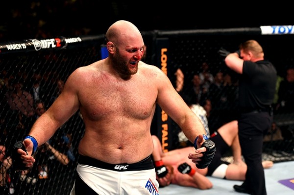 NEWARK, NJ - JANUARY 30:  (L-R) Ben Rothwell celebrates his submission victory over Josh Barnett in their heavyweight bout during the UFC Fight Night event at the Prudential Center on January 30, 2016 in Newark, New Jersey. (Photo by Josh Hedges/Zuffa LLC/Zuffa LLC via Getty Images)