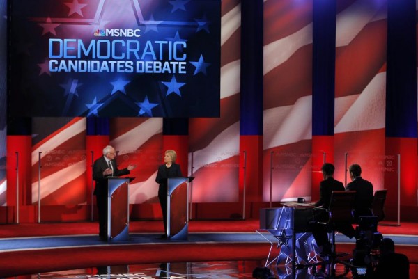 Bernie Sanders and Hillary Clinton discuss an issue.  REUTERS/Mike Segar