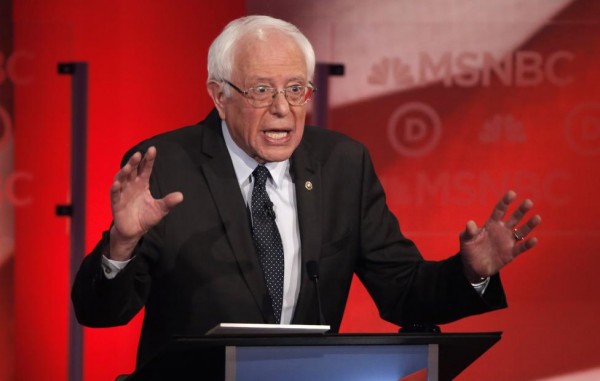 Bernie Sanders debates Hillary Clinton. REUTERS/Mike Segar