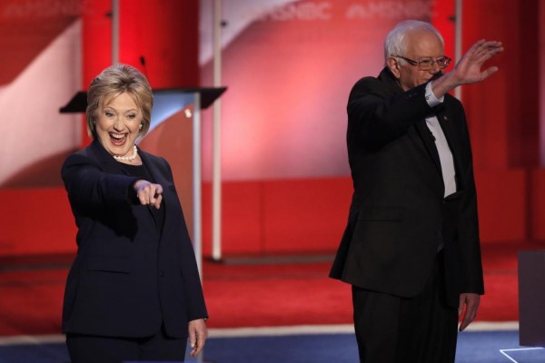 Hillary Clinton and Bernie Sanders take the stage. REUTERS/Mike Segar
