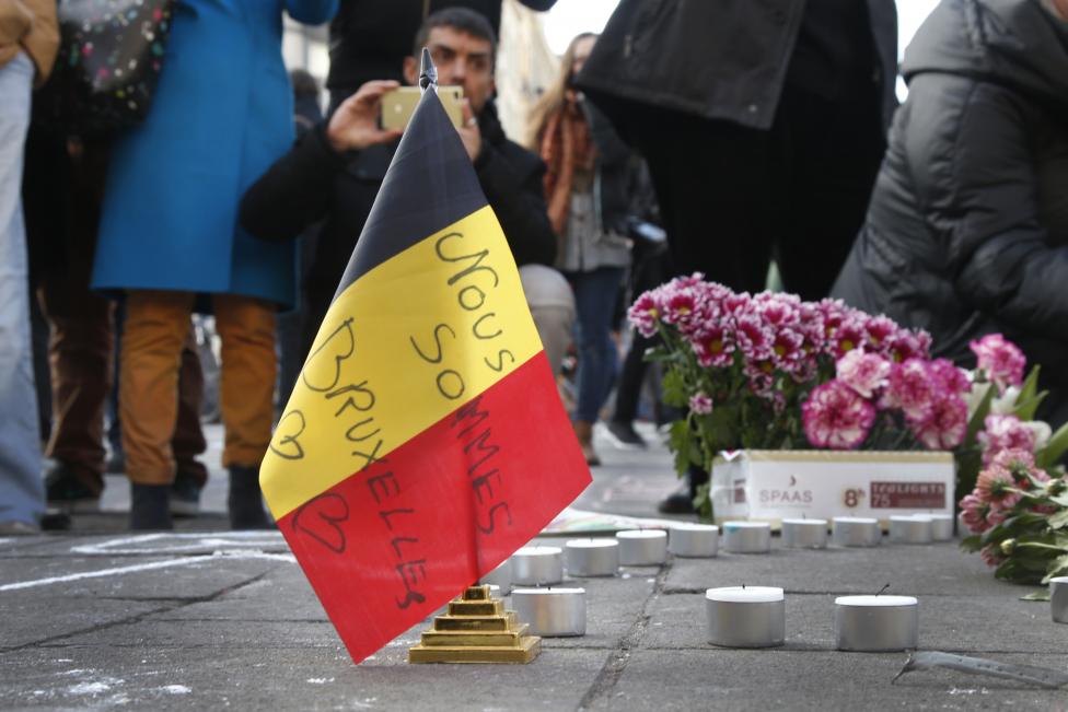 People gather around a memorial in Brussels following bomb attacks s in Brussels, Belgium, March 22, 2016. REUTERS/Charles Platiau