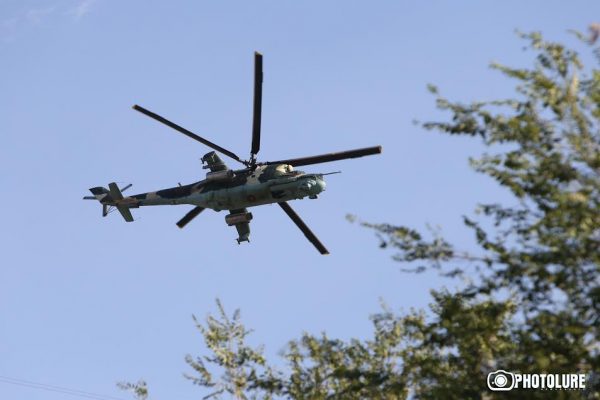 Helicopters fly over Patrol-Guard Service Regiment of Erebuni district in Yerevan, Armenia