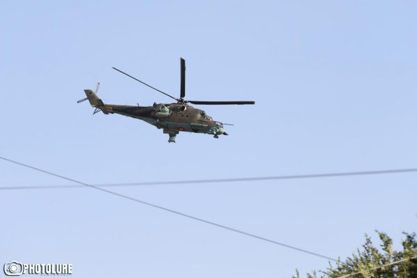 Helicopters fly over Patrol-Guard Service Regiment of Erebuni district in Yerevan, Armenia