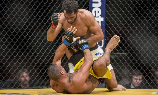 Jul 9, 2016; Las Vegas, NV, USA; Thiago Santos (blue gloves) blocks Gegard Mousasi (red gloves) during UFC 200 at T-Mobile Arena. Mandatory Credit: Joshua Dahl-USA TODAY Sports