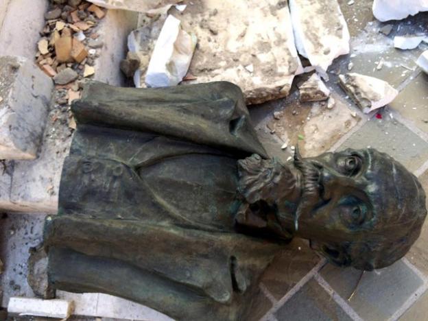 A bust is seen on the ground following an earthquake in Accumoli di Rieti, central Italy, August 24, 2016. REUTERS/Steve Scherer