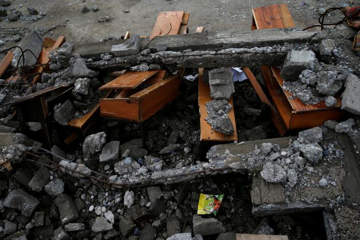 Destroyed desks are seen in a school in Jeremie, Haiti. REUTERS/Carlos Garcia Rawlins