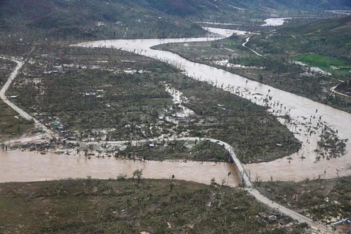 A flooded river and destroyed houses are seen after Hurricane Matthew passes Jeremie, Haiti, October 5, 2016. REUTERS/Carlos Garcia Rawlins