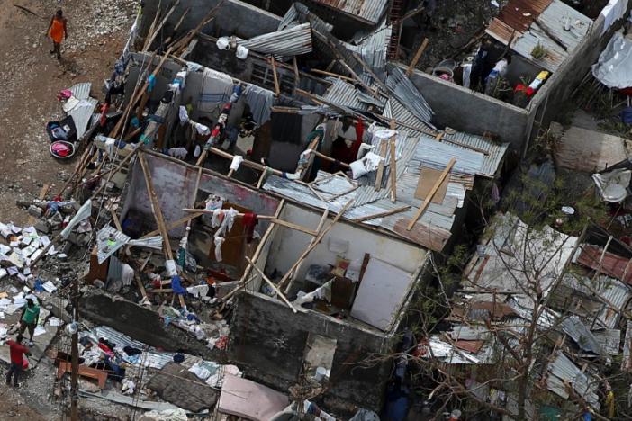 People try to rebuild their destroyed houses after Hurricane Matthew passes Jeremie, Haiti, October 6, 2016. REUTERS/Carlos Garcia Rawlins